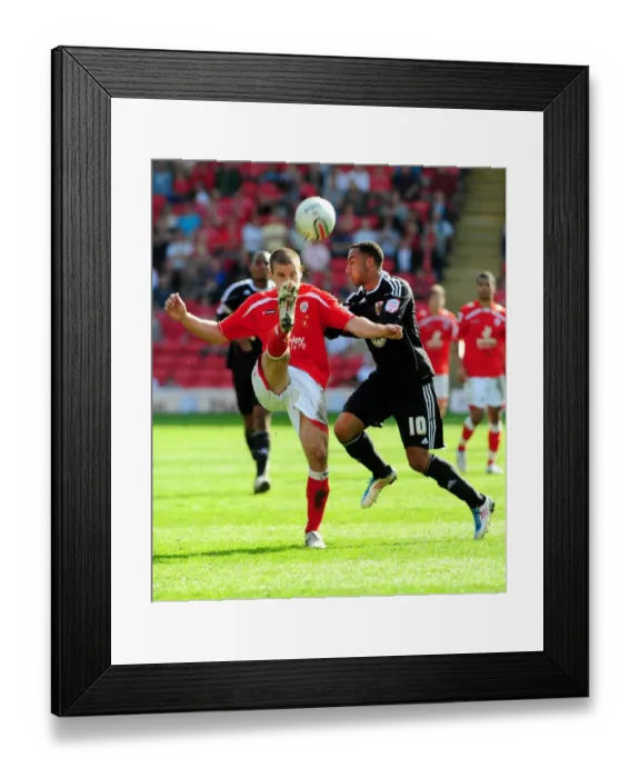 Framed Print : Battling for Supremacy: Nicky Maynard vs. Stephen Foster in the Championship Clash between Barnsley and Bristol City (09 / 04 / 2011)