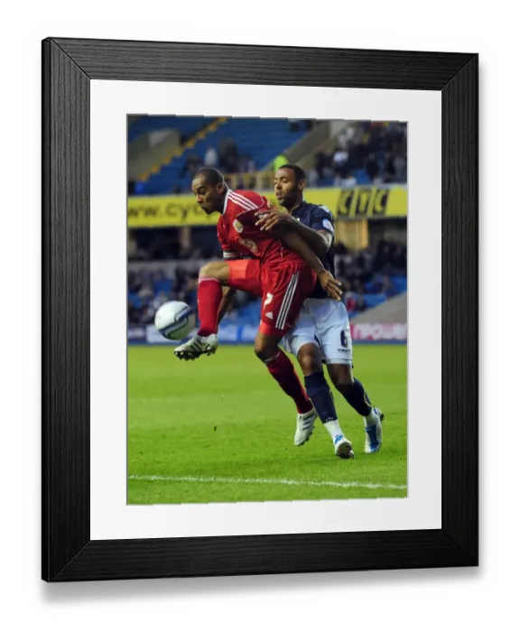 Framed Print : Battling for Supremacy: Marvin Elliott vs. Liam Trotter in the Championship Clash between Millwall and Bristol City Framed Print : Battling for Supremacy: Marvin Elliott vs. Liam Trotter in the Championship Clash between Millwall and Bristol City