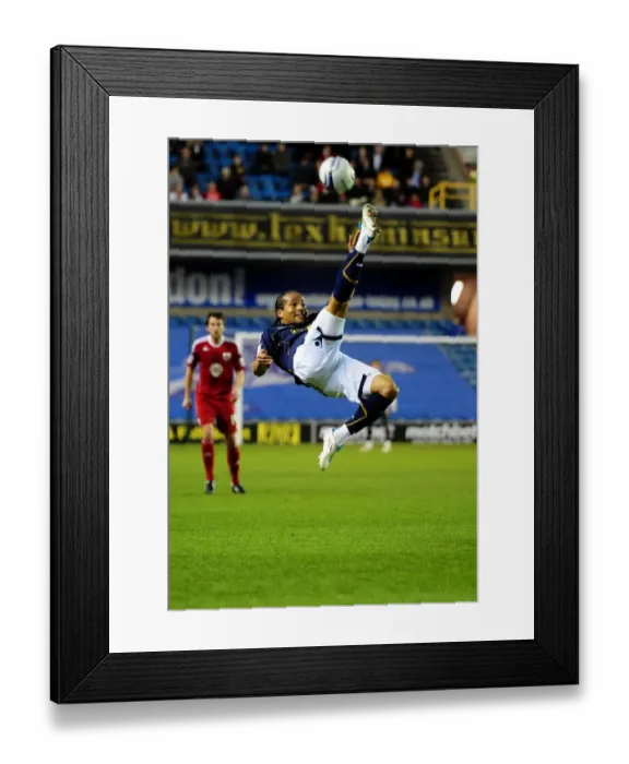 Framed Print : Mkandawire Clears the Ball: Millwall vs. Bristol City, Championship Match, The Den, 12th April 2011