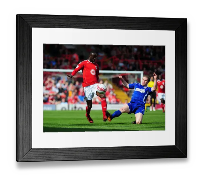 Framed Print : Adomah Evasive Move Against Leadbitter in Championship Clash: Bristol City vs Ipswich Town (16-04-2011)