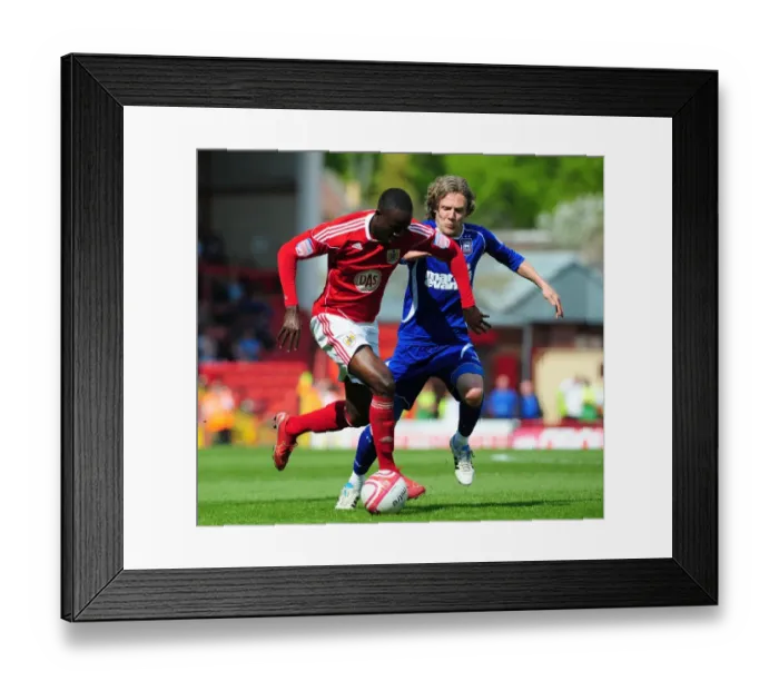 Framed Print : Adomah vs Bullard: Intense Battle for Ball Possession in Bristol City vs Ipswich Town Championship Clash, April 2011 Framed Print : Adomah vs Bullard: Intense Battle for Ball Possession in Bristol City vs Ipswich Town Championship Clash, April 2011