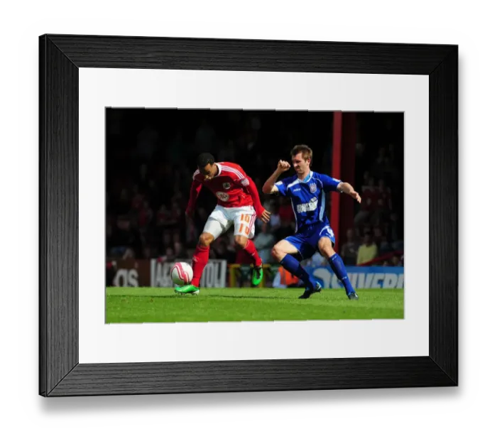Framed Print : Bristol City's Nicky Maynard Holds Off Ipswich's Gareth McAuley in Championship Clash at Ashton Gate Stadium (16-Apr-2011) Framed Print : Bristol City's Nicky Maynard Holds Off Ipswich's Gareth McAuley in Championship Clash at Ashton Gate Stadium (16-Apr-2011)