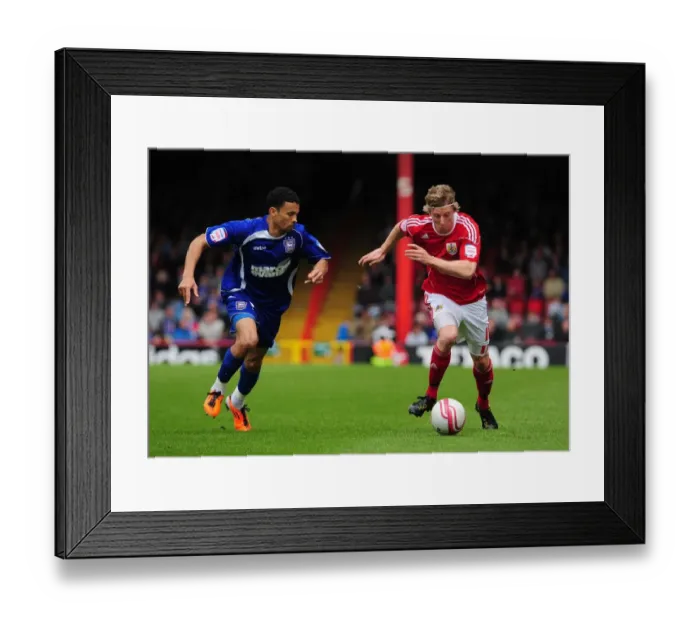 Framed Print : Bristol City's Martyn Woolford Outsmarts Carlos Edwards in Championship Showdown at Ashton Gate Stadium (16-04-2011) Framed Print : Bristol City's Martyn Woolford Outsmarts Carlos Edwards in Championship Showdown at Ashton Gate Stadium (16-04-2011)
