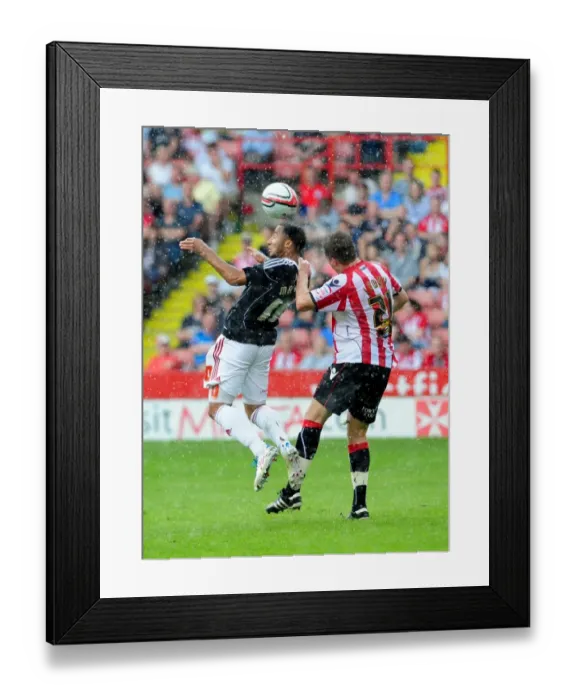 Framed Print : Battling for Supremacy: Maynard vs. Lowry in the Championship Clash between Sheffield United and Bristol City (April 2011)