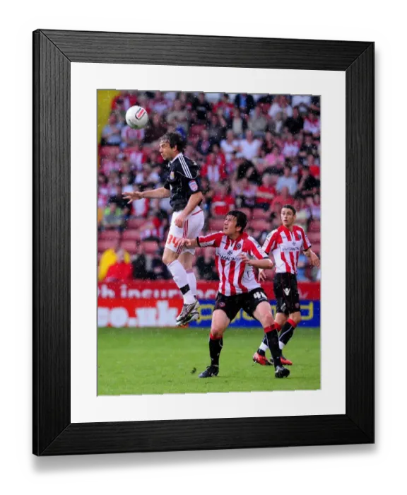 Framed Print : Battling for Supremacy: Brett Pitman vs. Harry Maguire in the 2011 Championship Clash between Sheffield United and Bristol City