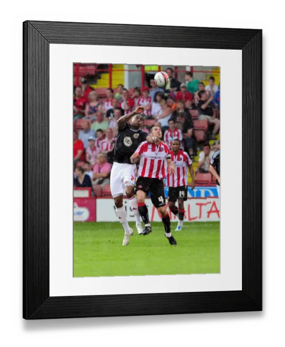 Framed Print : Battling for Supremacy: Marvin Elliott vs. Nick Montgomery in Sheffield United vs. Bristol City Championship Clash, 23rd April 2011 Framed Print : Battling for Supremacy: Marvin Elliott vs. Nick Montgomery in Sheffield United vs. Bristol City Championship Clash, 23rd April 2011