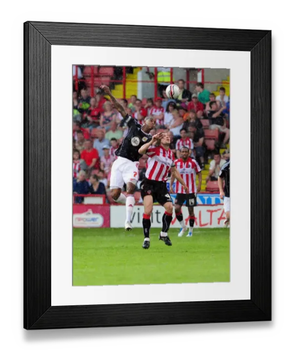 Framed Print : Battling for Championship Supremacy: Marvin Elliott vs. Nick Montgomery, Sheffield United vs. Bristol City (April 2011) Framed Print : Battling for Championship Supremacy: Marvin Elliott vs. Nick Montgomery, Sheffield United vs. Bristol City (April 2011)