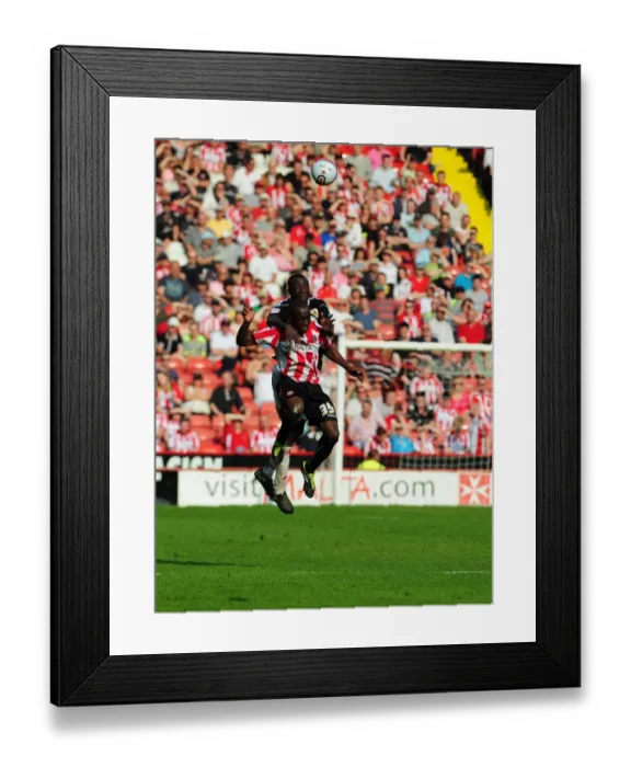 Framed Print : Battling for the Ball: Damion Stewart vs. Jordan Slew in Sheffield United vs. Bristol City Championship Clash (April 2011)