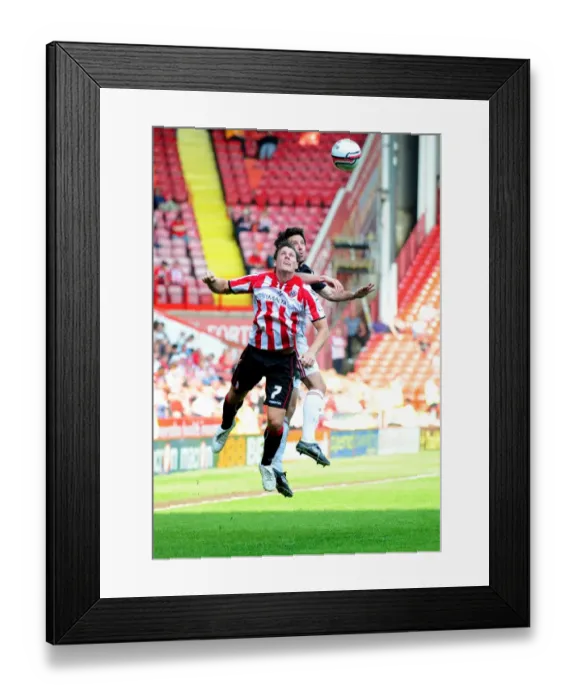 Framed Print : Battling for Supremacy: Cole Skuse vs. Darius Henderson in Sheffield United vs. Bristol City Championship Clash (23 / 04 / 2011)