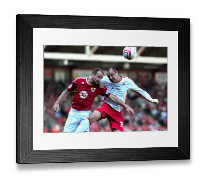 Framed Print : Battle for Supremacy: Louis Carey vs. Kris Boyd - Championship Showdown at Ashton Gate, 25th April 2011