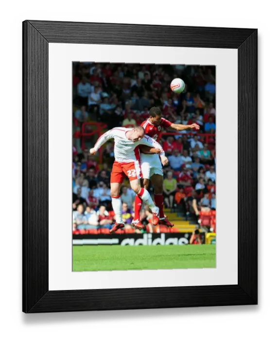Framed Print : Aerial Battle: Nyatenge vs. Boyd - Championship Showdown at Ashton Gate (Bristol City vs. Nottingham Forest, 25-04-2011) Framed Print : Aerial Battle: Nyatenge vs. Boyd - Championship Showdown at Ashton Gate (Bristol City vs. Nottingham Forest, 25-04-2011)