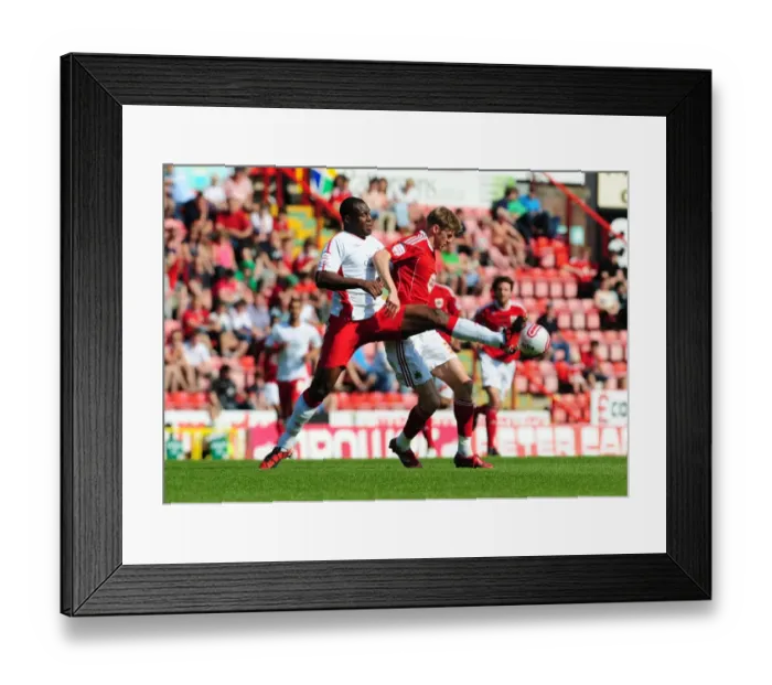 Framed Print : Battling for Supremacy: Jon Stead vs. Wes Morgan in the 2011 Championship Clash between Bristol City and Nottingham Forest