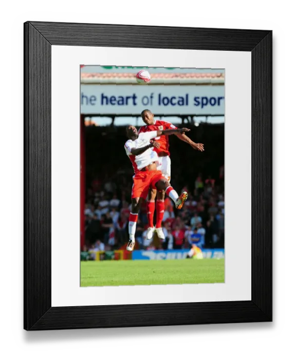 Framed Print : Battling for Supremacy: Marvin Elliott vs Guy Moussi in the Championship Clash between Bristol City and Nottingham Forest (25 / 04 / 2011) Framed Print : Battling for Supremacy: Marvin Elliott vs Guy Moussi in the Championship Clash between Bristol City and Nottingham Forest (25 / 04 / 2011)