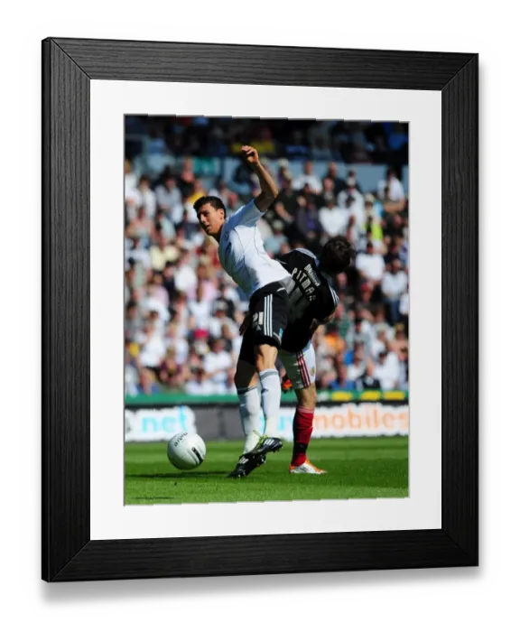 Framed Print : Battling for Supremacy: Brett Pitman vs. Daniel Ayala in the Derby County vs. Bristol City Championship Clash, April 2011