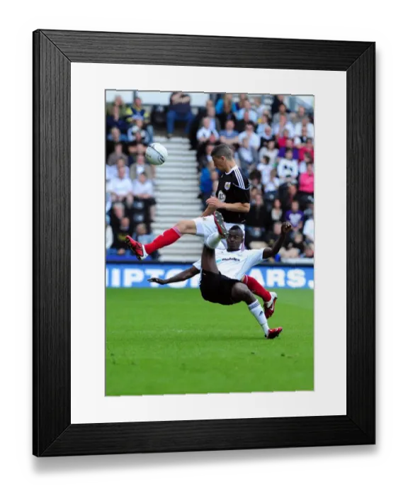 Framed Print : Battling for Supremacy: Wilson vs. Robinson in the Derby County vs. Bristol City Championship Clash, April 2011 Framed Print : Battling for Supremacy: Wilson vs. Robinson in the Derby County vs. Bristol City Championship Clash, April 2011