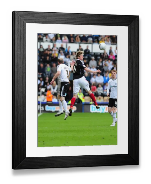 Framed Print : Derby County vs. Bristol City: Intense Battle for the Championship Ball - Martyn Woolford vs. Gareth Roberts (30th April 2011)