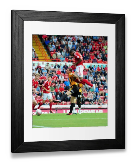 Framed Print : Defiant Marvin Elliott's Near-Miss Header: A Moment of Drama in the 2011 Championship Clash between Bristol City and Hull City