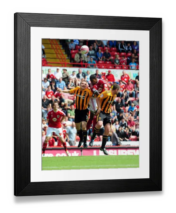 Framed Print : Marvin Elliott's Close Header: Championship Clash Between Bristol City and Hull City, May 2011 Framed Print : Marvin Elliott's Close Header: Championship Clash Between Bristol City and Hull City, May 2011