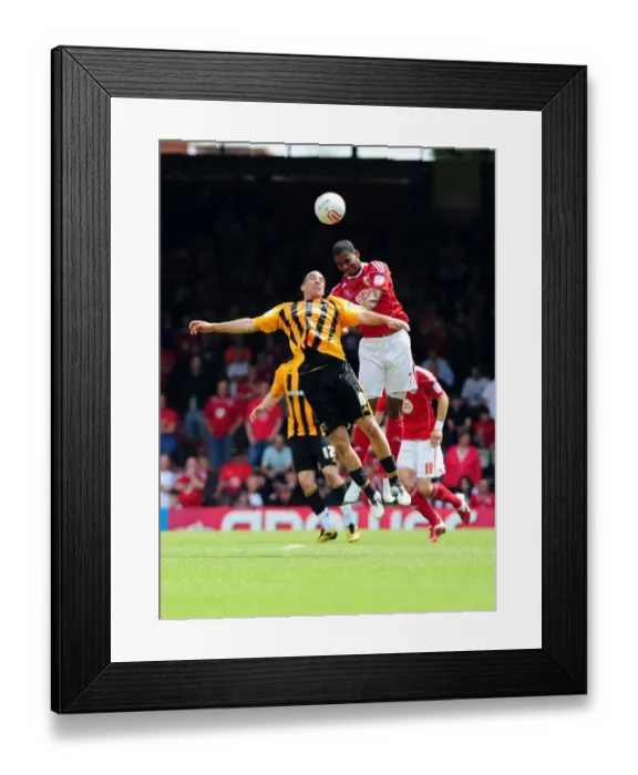 Framed Print : Bristol City vs Hull City: Marvin Elliott vs James Harper's Intense Battle for the High Ball in Championship Match, May 2011 Framed Print : Bristol City vs Hull City: Marvin Elliott vs James Harper's Intense Battle for the High Ball in Championship Match, May 2011