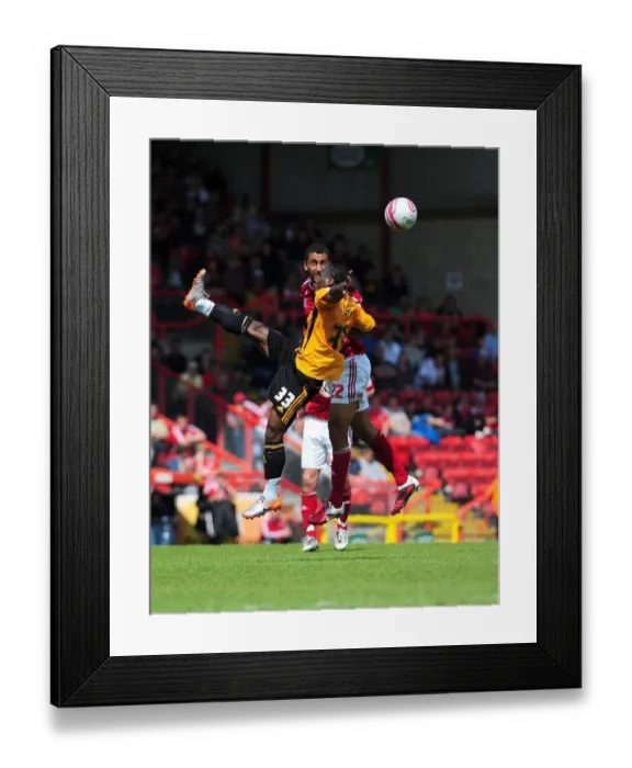 Framed Print : Bristol City vs Hull City: Intense Aerial Battle Between Lowein Nyatanga and Aaron Mclean, Championship Match, May 2011