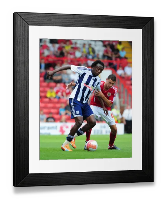 Framed Print : Bristol City vs. West Brom: Intense Battle Between James Wilson and Somen Tchoyi in Championship Match, 2011 Framed Print : Bristol City vs. West Brom: Intense Battle Between James Wilson and Somen Tchoyi in Championship Match, 2011