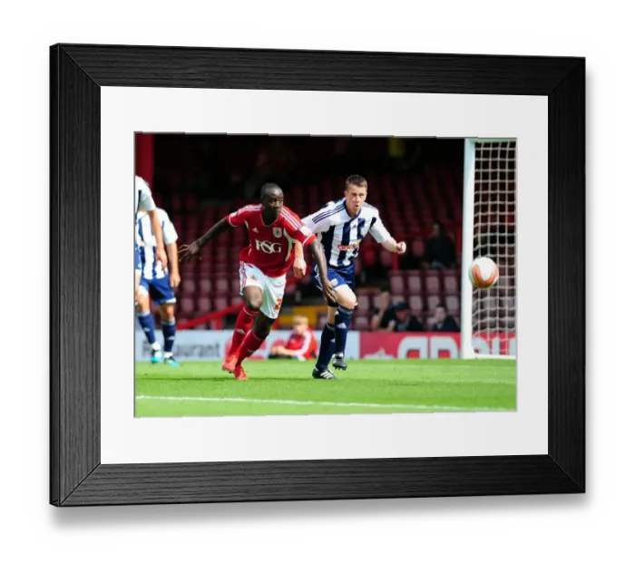 Framed Print : Adomah vs. Shorey: Intense Battle for Possession in Bristol City vs. West Brom Championship Clash (30 / 07 / 2011)
