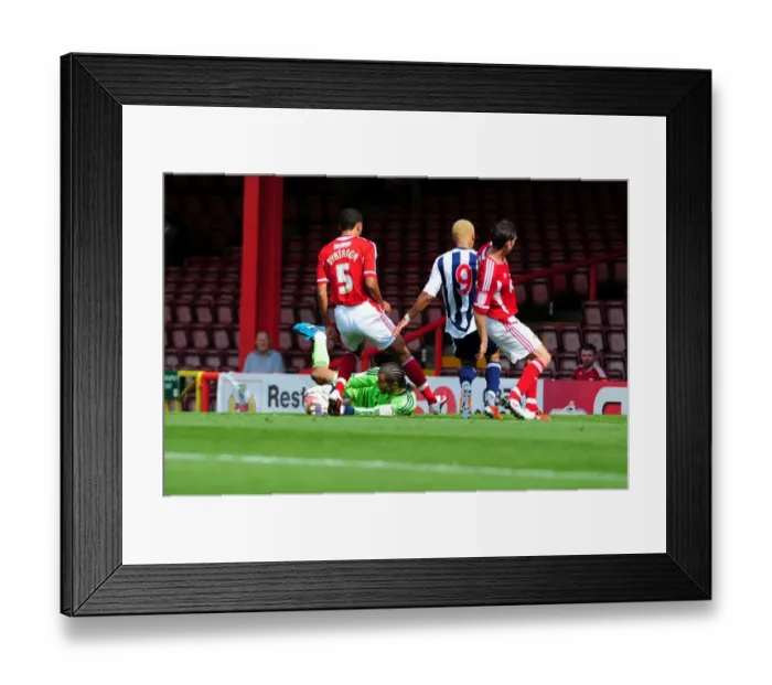 Framed Print : Bristol City's David James Denies West Brom's Peter Odemwingie: A Championship Showdown at Ashton Gate, 2011