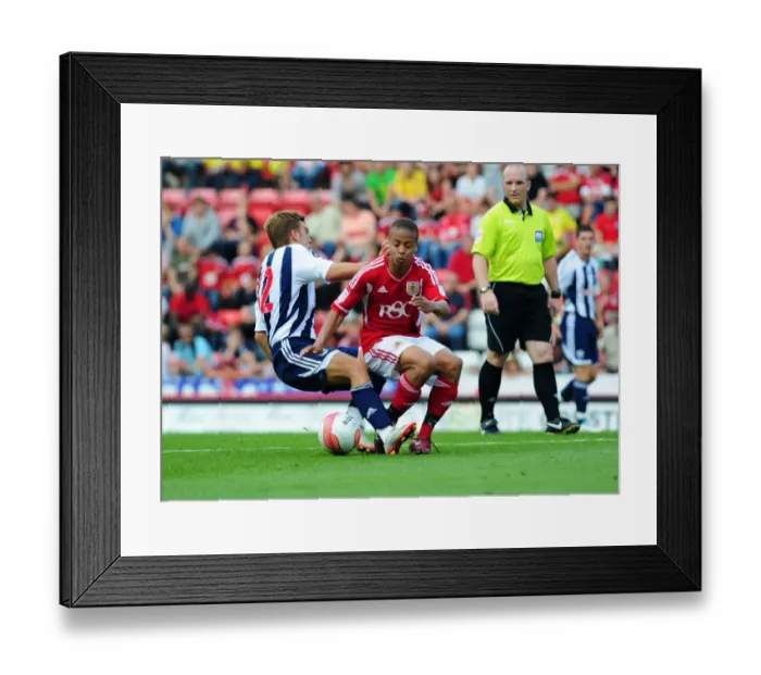 Framed Print : Bobby Reid vs. James Morrison: A Battle for Possession in the 2011 Championship Clash between Bristol City and West Brom Framed Print : Bobby Reid vs. James Morrison: A Battle for Possession in the 2011 Championship Clash between Bristol City and West Brom