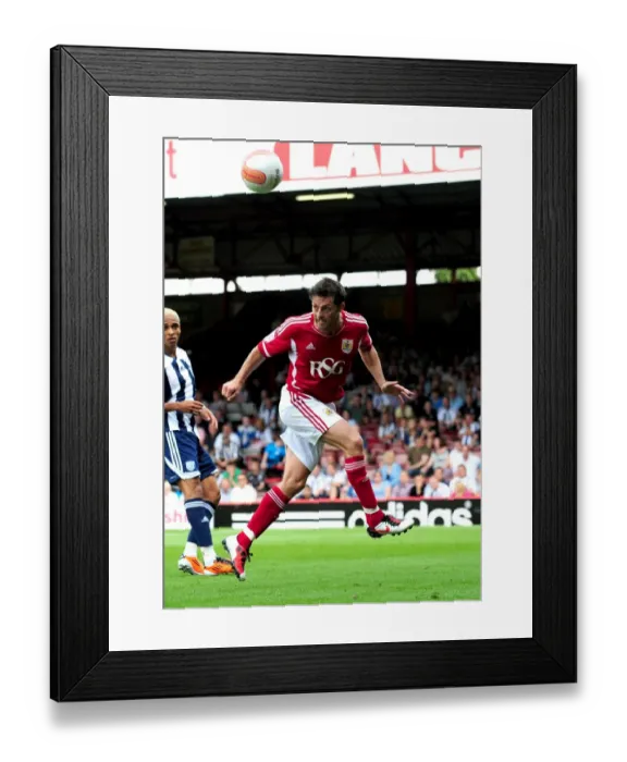 Framed Print : Bristol City's Jamie McAllister Clears the Ball in Championship Clash Against West Brom, 2011 Framed Print : Bristol City's Jamie McAllister Clears the Ball in Championship Clash Against West Brom, 2011