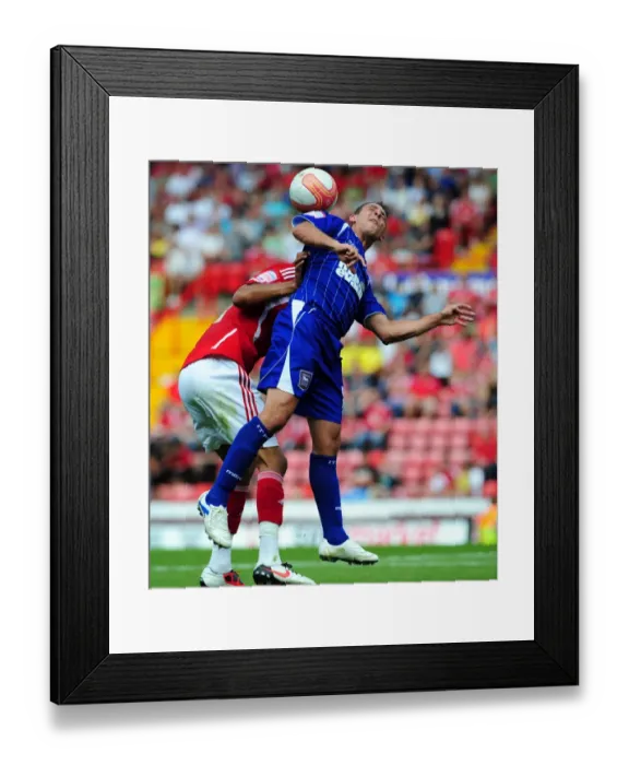 Framed Print : Championship Showdown: Chopra vs. Fontaine - A Battle for Aerial Supremacy at Ashton Gate (Bristol City v Ipswich Town, 06 / 08 / 2011)