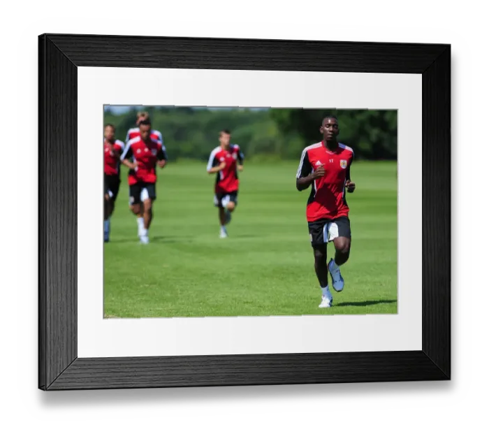 Framed Print : Bristol Citys yannick bolasie joins team mates at Bristol city