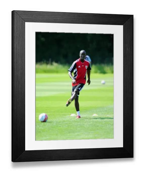 Framed Print : Albert Adomah's Unwavering Focus: Braving the Elements in Bristol City's Pre-season Training