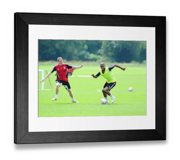 Framed Print : Bristol City: Intense Training Battle between Marvin Elliott and David Clarkson