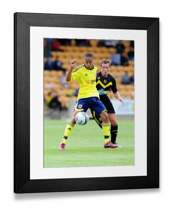 Framed Print : Bobby Reid's Determined Struggle for Possession: Torquay vs. Bristol City Framed Print : Bobby Reid's Determined Struggle for Possession: Torquay vs. Bristol City