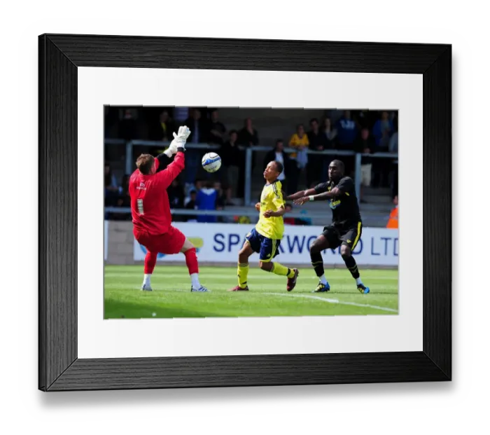 Framed Print : Bristol City's Bobby Reid Leaps to Clear the Bar, but Just Short (Torquay vs. Bristol City)