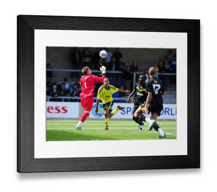Framed Print : Bristol Citys Bobby Reid attempts to life the ball over the keeper but his effort isn t quite
