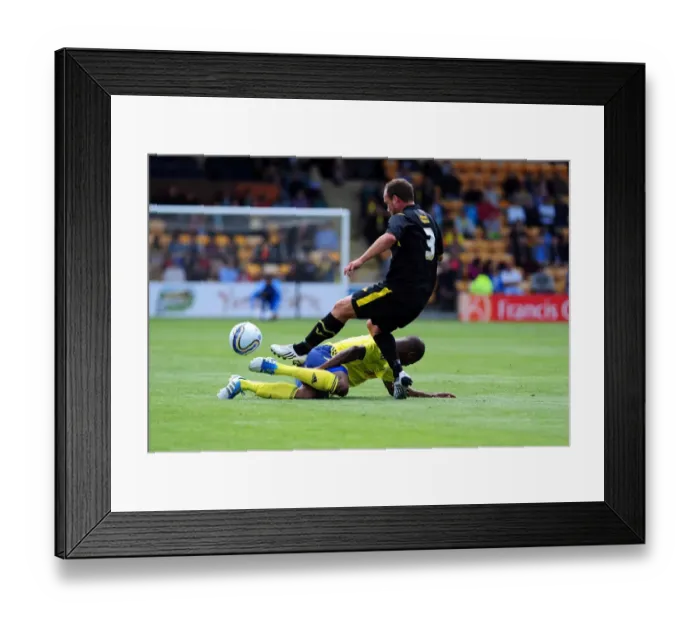 Framed Print : Determined Marvin Elliott Tackles in Torquay vs. Bristol City Clash