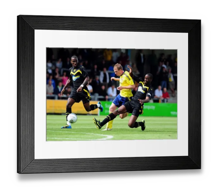Framed Print : Bristol Citys David Clarkson is thwarted by the Torquay defence