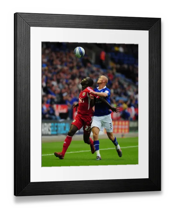Framed Print : Adomah vs. Konchesky: Battle for the Ball in Leicester City vs. Bristol City Championship Match, 2011