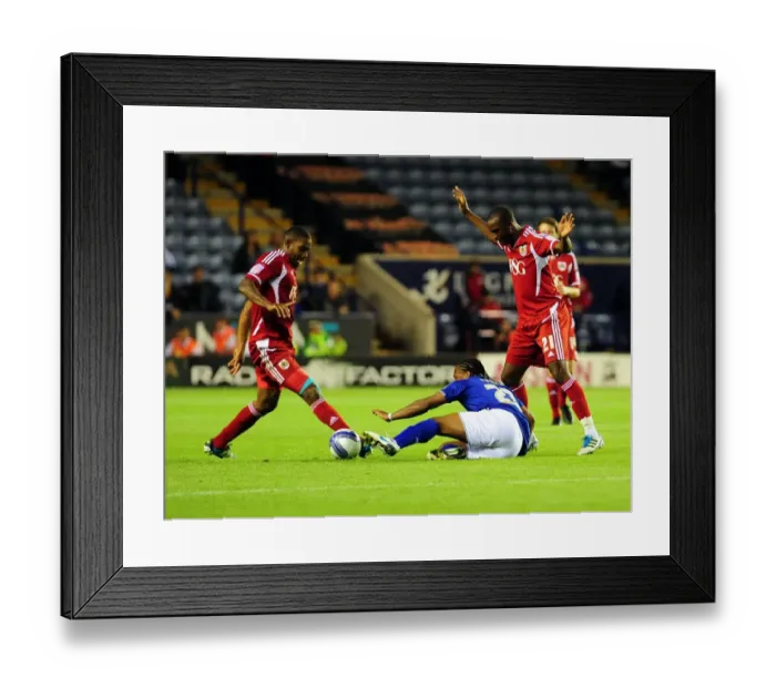 Framed Print : Neil Danns vs. Marvin Elliott and Kalifa Cisse: Intense Battle in Leicester City vs. Bristol City Championship Match, August 2011