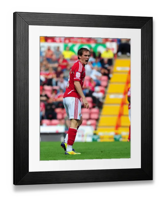 Framed Print : Bristol City's Neil Kilkenny in Action: Championship Clash between Bristol City and Portsmouth at Ashton Gate Stadium (2011) - Editorial Use Only Framed Print : Bristol City's Neil Kilkenny in Action: Championship Clash between Bristol City and Portsmouth at Ashton Gate Stadium (2011) - Editorial Use Only