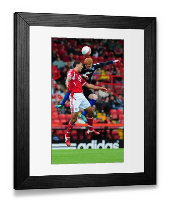 Framed Print : Bristol City vs Portsmouth: Intense Battle for the High Ball between Lewin Nyatanga and Dave Kitson in the 2008-09 Championship Match Framed Print : Bristol City vs Portsmouth: Intense Battle for the High Ball between Lewin Nyatanga and Dave Kitson in the 2008-09 Championship Match