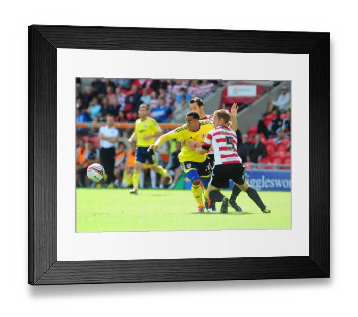 Framed Print : Bristol City's Nicky Maynard vs Doncaster Rovers Richard Naylor in League Cup Clash, 27 / 08 / 2011