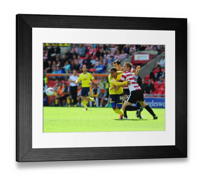 Framed Print : Football Rivalry: Nicky Maynard vs Richard Naylor in the 2011 League Cup Clash between Doncaster Rovers and Bristol City