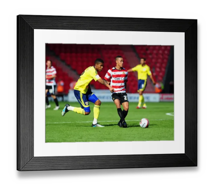 Framed Print : Battle for the Ball: Jordan Spence vs. Kyle Bennett - League Cup Clash, Doncaster Rovers vs. Bristol City (27 / 08 / 2011)