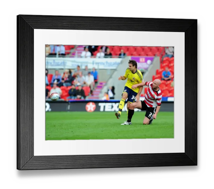 Framed Print : Doncaster's O'Connor Tackles Pitman in League Cup Clash between Doncaster Rovers and Bristol City - 27 / 08 / 2011