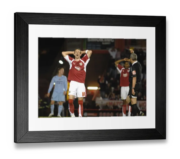 Framed Print : Michael McIndoe vs Manchester City: A Moment from the Bristol City Clash Framed Print : Michael McIndoe vs Manchester City: A Moment from the Bristol City Clash