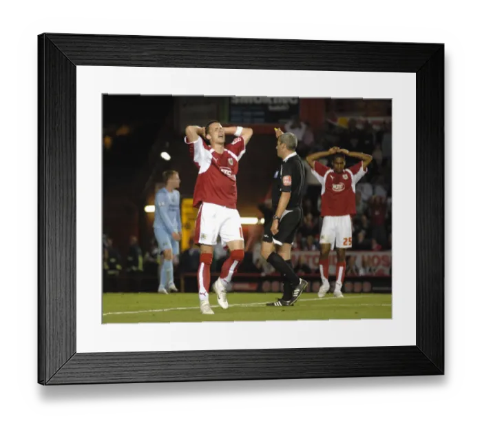 Framed Print : Moment of Determination: Michael McIndoe vs Manchester City (Bristol City Clash)