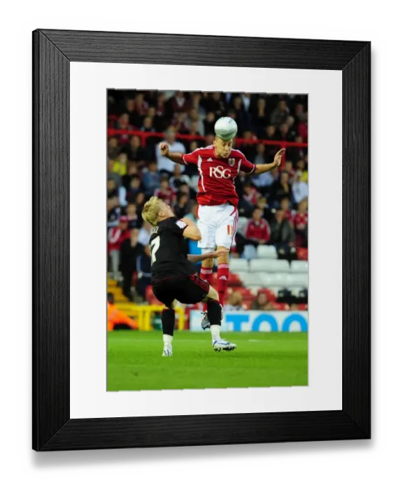 Framed Print : Bristol City vs Swindon Town: James Wilson vs Alan Connell in Intense League Cup Clash at Ashton Gate Stadium (August 24, 2011) Framed Print : Bristol City vs Swindon Town: James Wilson vs Alan Connell in Intense League Cup Clash at Ashton Gate Stadium (August 24, 2011)