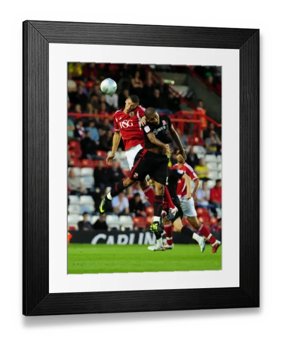 Framed Print : Intense League Cup Clash: James Wilson vs Leon Clarke at Ashton Gate Stadium (August 2011) - Bristol City vs Swindon Town Framed Print : Intense League Cup Clash: James Wilson vs Leon Clarke at Ashton Gate Stadium (August 2011) - Bristol City vs Swindon Town